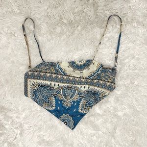 Cropped blue and white shirt with tie up in the back and adjustable straps